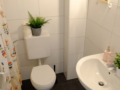 Monteurwohnung - Badezimmer: Gemeinschaftsbad - City Apartment Stein 