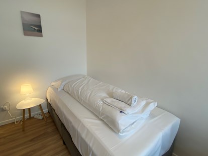 Monteurwohnung - Badezimmer: eigenes Bad - Bettenansicht - Monteurwohnungen in Klagenfurt am Wörthersee