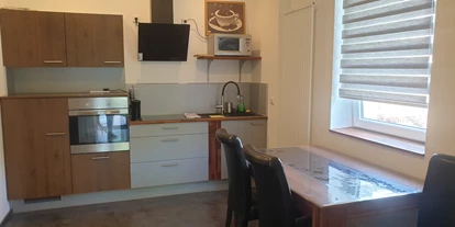 Monteurwohnung - Zimmertyp: Mehrbettzimmer - moderne Küche - FeWo "Taunusgast"