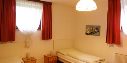 Monteurwohnung - WLAN - Föderlach I - Schlafzimmer mit zwei Einzelbetten - Appartements Kubisko