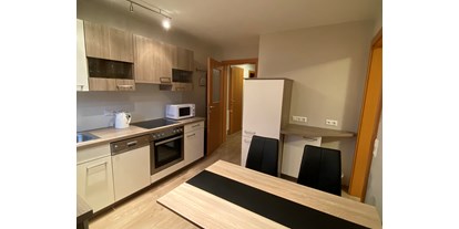 Monteurwohnung - Einzelbetten - Ernegg - Ferienwohnung Winter Küche - Privatzimmer & Ferienwohnungen Leeb