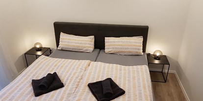 Monteurwohnung - Bettwäsche: Bettwäsche gegen Gebühr - Schlafzimmer  - Ferienhaus am See Goch-Kessel