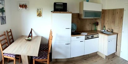 Monteurwohnung - Art der Unterkunft: Apartment - Landskron - Küche und Sitzgelegenheit - Ferienwohnung Monfreda - Made for better days 2