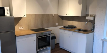 Monteurwohnung - Einzelbetten - Padingbüttel - Die Küche ist geräumig und mit allem ausgestattet was man für den täglichen Gebrauch benötigt.  - MB Holiday Apartment