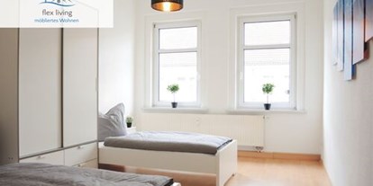 Monteurwohnung - Waschmaschine - Gustow - Beispielbild Schlafzimmer - flex living - Monteurwohnungen in Stralsund (DEU|EN|PL|HU)