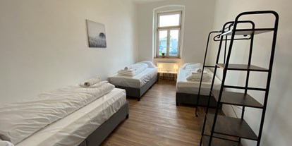Monteurwohnung - Waschmaschine - Zimmeransicht - Monteurwohnungen in Klagenfurt am Wörthersee