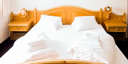 Monteurwohnung - Bettwäsche: Bettwäsche inklusive - Mumpé Medel - Hotel Postigliun