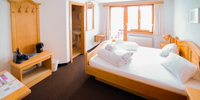Monteurwohnung - Bettwäsche: Bettwäsche inklusive - Schweiz - Hotel Postigliun