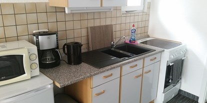 Monteurwohnung - Waschmaschine - Brandenburg Süd - Eine Küche im Wohnbereich - Monteurwohnung, Nähe Wittenberg