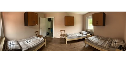 Monteurwohnung - Waschmaschine - Schlafzimmer - Franz Berg Apartments