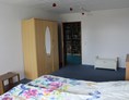Monteurzimmer: Schlafzimmer mit Doppelbett - Fewosan Sandstedt