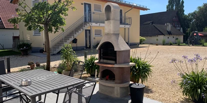 Monteurwohnung - Aalen wasseralfingen - Terrasse im EG mit Grillkamin - Haag Ferienwohnungen
