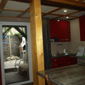 Monteurwohnung: Küche mit direktem Zugang zum Garten - Monteurwohnung Groß-Gerau