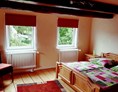Monteurzimmer: Schlafzimmer I 180x200 - Ferienwohnung Trompeter