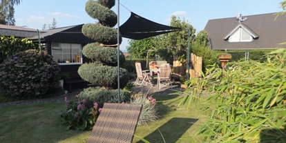 Monteurwohnung - PLZ 31860 (Deutschland) - Garten mit Liege und Sitzplatz - Ferienwohnung "Am Mönkeberg" in Emmerthal