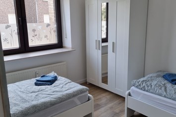 Monteurzimmer: Schlafzimmer - Monteurswohnung TAKAppartement Dormagen EG