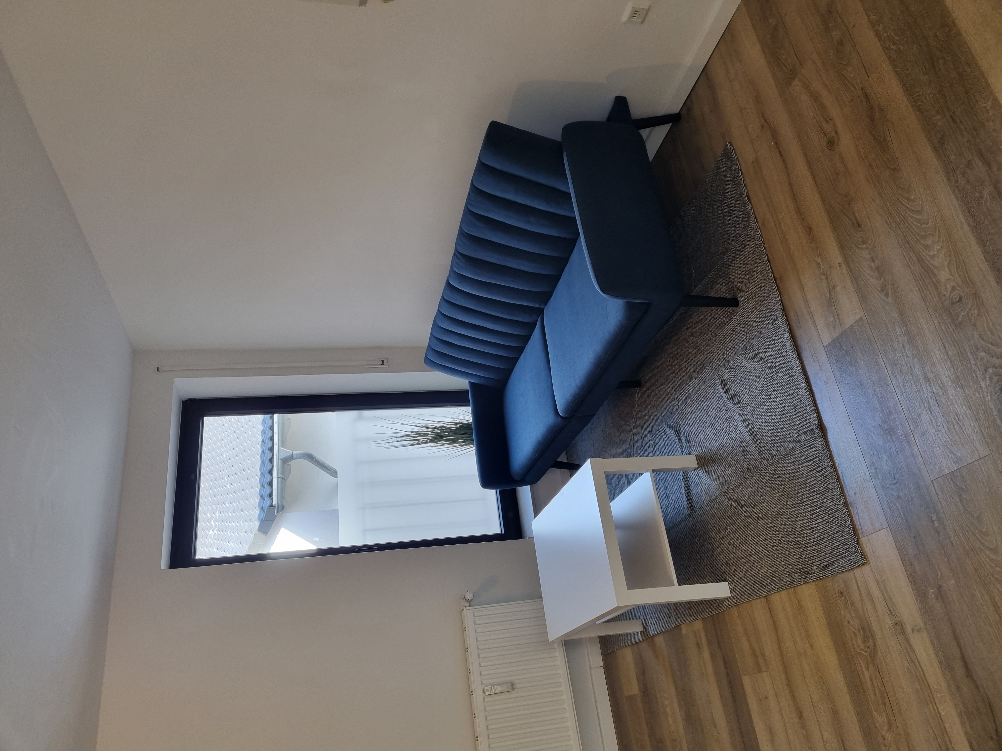 Monteurwohnung - Kaffeemaschine - Neuss - Wohnbereich mit Schlafcouch - Monteurswohnung TAKAppartement Dormagen OG