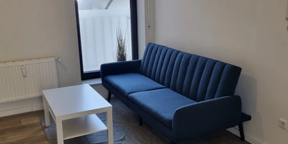 Monteurwohnung - PLZ 42697 (Deutschland) - Wohnbereich mit Schlafcouch - Monteurswohnung TAKAppartement Dormagen OG