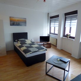 Monteurzimmer: Wohn-Schlafbereich EG - Modernisierte Appartements