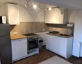 Monteurzimmer: Die Küche ist geräumig und mit allem ausgestattet was man für den täglichen Gebrauch benötigt.  - MB Holiday Apartment