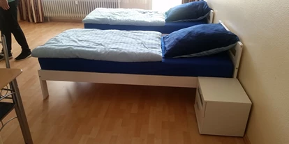 Monteurwohnung - Muggensturm Gaggenau - Einzelbetten im Wohnbereich - Monteurwohnung Rastatt