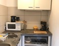 Monteurzimmer: Voll ausgestattete Küche (kein Backofen) - Wohnung-Sandkrug