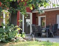 Monteurzimmer: Terrasse mit Sitzgelegenheit - Ferienhaus "NaturPur"