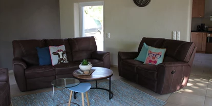 Monteurwohnung - Badezimmer: eigenes Bad - Münsterland - Wohnzimmer mit Relaxsofa - Ferienhaus "NaturPur"