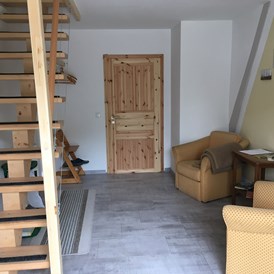 Monteurzimmer: Eingangsbereich zur Küche und zur oberen Etage  - Zumspatzennest
