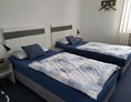 Monteurzimmer: Jede Wohnung hat 2 Schlafzimmer mit jeweils 2 getrennten Betten - Sleep Inn Hagen