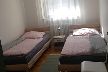 Monteurzimmer: Kleines Schlafzimmer - Ferienwohnung Am Tobelbach