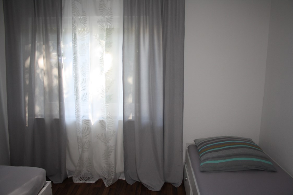 Monteurzimmer: Schlafzimmer mit Einzelbetten in den Apartments - Refugium
