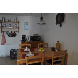 Monteurzimmer: Sitzplatz Küche, Kaminzauber   - Ferienwohnung Alter Raaben