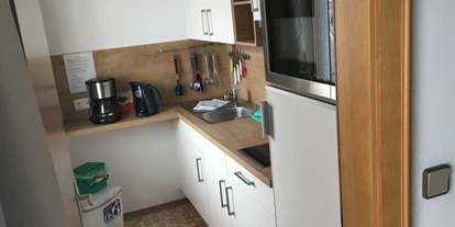 Monteurwohnung - Einzelbetten - Tirol - Küche Studio  - Alpenhof Wildschönau Apartment Zimmer