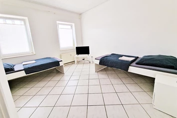 Monteurzimmer: Schlafzimmer, HomeRent Unterkunft in Düren - HomeRent in Düren