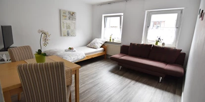Monteurwohnung - Balkon - Deutschland - Wohn-/Schlafzimmer, HomeRent Unterkunft in Troisdorf - HomeRent in Troisdorf