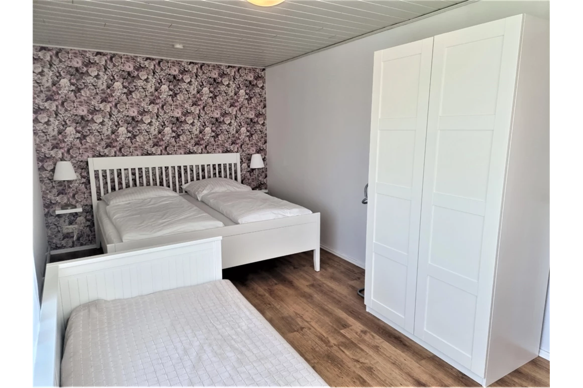 Monteurzimmer: Schlafzimmer II - DOLLE SCHOLLE: Wohnung mit Platz für bis zu 5 Gäste