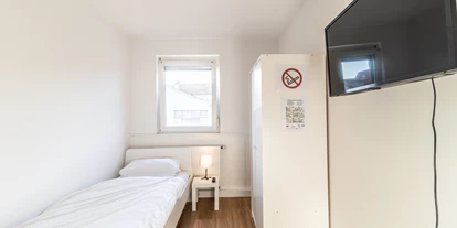 Monteurwohnung - Muggensturm Gaggenau - Ideal als Monteurzimmer – getrennte Betten und funktionale Einrichtung.
 - flex living -  Monteurwohnungen in Karlsruhe