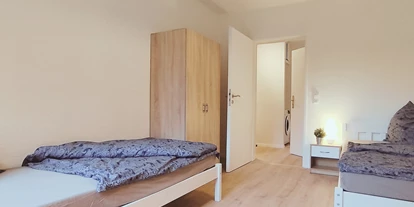 Monteurwohnung - Parkplatz: kostenlose Parkplätze in der Straße - Bremen-Umland - Schlafzimmer - flex living -  Monteurwohnungen in Delmenhorst